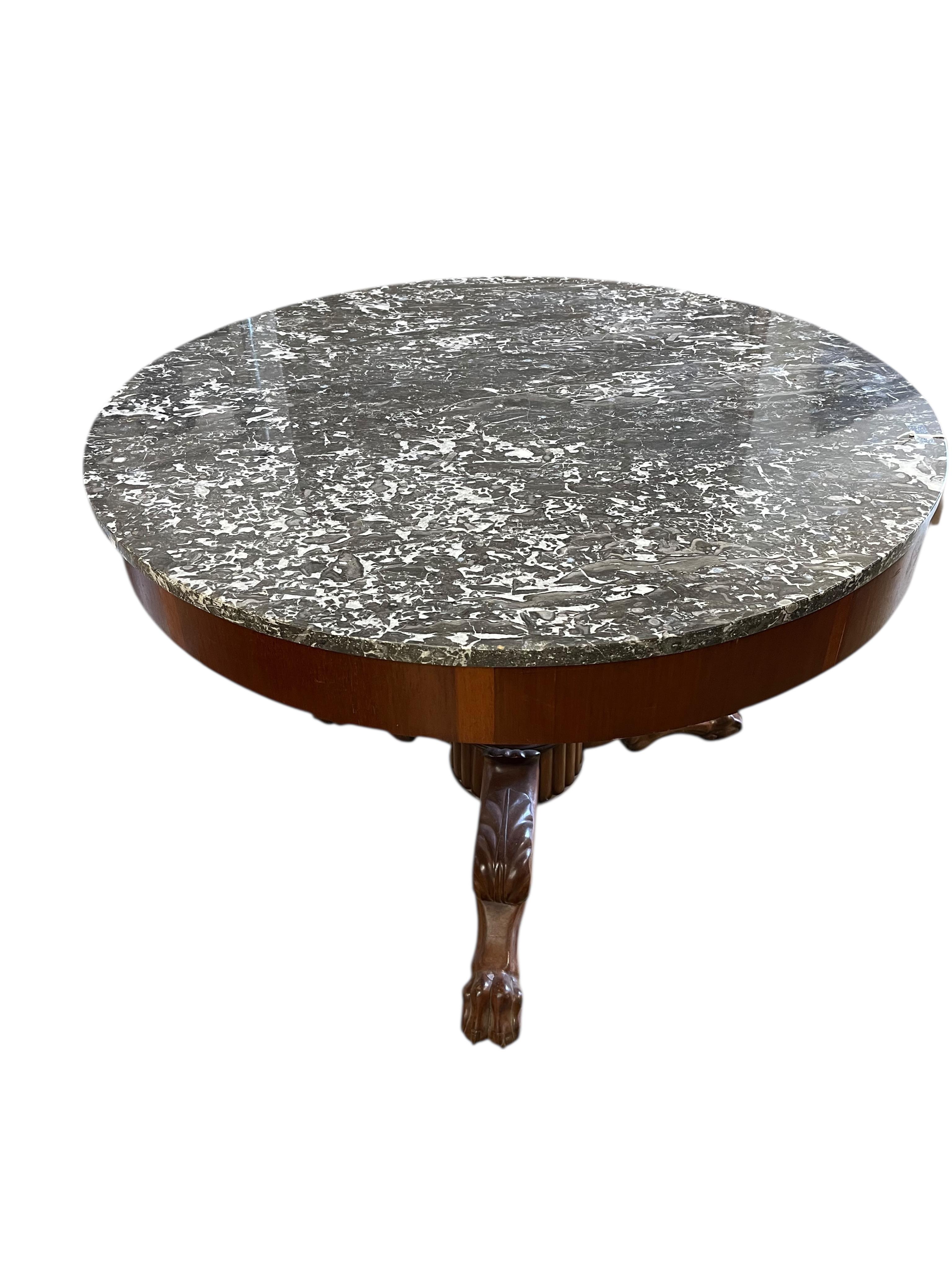 A French circular mahogany marble topped centre table, diameter 100cm, height 70cm